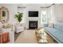 Bright living room with fireplace, stylish decor, and large windows offering plenty of natural light at 126 Maritime Way, Summerville, SC 29485