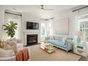 Bright living room with fireplace, stylish decor, and large windows offering plenty of natural light at 126 Maritime Way, Summerville, SC 29485