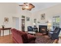 Cozy living room featuring a fireplace, hardwood floors, and ample natural light at 1725 Henley Ln, Charleston, SC 29412