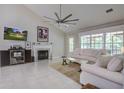Cozy living room with a fireplace, tile floors, and a door that leads to an outdoor area at 2154 Country Manor Dr Dr, Mount Pleasant, SC 29466