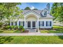 Inviting home featuring well-maintained lawn, tasteful shrubs, and covered entrance at 3084 Queensgate Way, Mount Pleasant, SC 29466