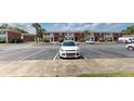 Apartment building exterior showing a parking lot with ample spaces and convenient access at 415 Parkdale Dr # 2F, Charleston, SC 29414