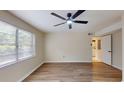 Bright living room featuring hardwood floors, a ceiling fan, and a large window with natural light at 415 Parkdale Dr # 2F, Charleston, SC 29414