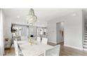 Open-concept dining room with stylish chandelier and ample natural light at 778 Clay Field Trl, Summerville, SC 29485
