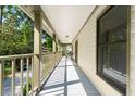 Long and cozy porch with wooden railings and a scenic outdoor view at 1016 Cider Ct, Summerville, SC 29483