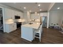 Modern kitchen with a large center island, stainless steel appliances, and white subway tile backsplash at 104 Pine Waters Ln, Summerville, SC 29483