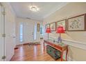 An open foyer with hardwood floors and a console table with decor at 105 Irish Oak Dr, Goose Creek, SC 29445