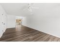 Bright living room with sleek wood-look flooring and modern ceiling fan at 122 Hornby Cir, Goose Creek, SC 29445