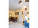 Bright living room with crown molding, carpeted flooring, ceiling fan, and an ample amount of natural light at 1300 Park West Blvd # 919, Mount Pleasant, SC 29466