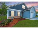 Charming home featuring a two-car garage, a welcoming front yard, and lovely landscaping near the house's entrance at 137 Clydesdale Cir, Summerville, SC 29486