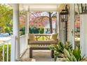 Inviting front porch with swing and comfortable pillows at 1511 Fairway Dr, Charleston, SC 29412