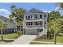 Beautiful two-story home with a welcoming porch, a well-maintained yard, and a cozy atmosphere at 1513 Cultivation Ln, Mount Pleasant, SC 29466