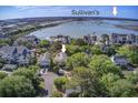 Beautiful aerial view of the neighborhood, close to the coast and nestled amongst lush trees at 1551 Ben Sawyer Blvd # 44, Mount Pleasant, SC 29464
