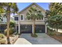 Charming home featuring a 2-car garage, beautiful landscaping, and classic architectural design at 1551 Ben Sawyer Blvd # 44, Mount Pleasant, SC 29464
