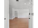 View from the front door into the light-filled living area with beautiful hardwood floors at 1915 Aichele Dr, North Charleston, SC 29406