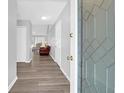 Inviting entryway showcasing wood flooring, neutral walls and decorative leaded glass front door at 1918 Armory Dr, Mount Pleasant, SC 29466