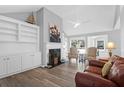 Bright living room features vaulted ceiling, built-in shelving and luxury vinyl plank flooring at 1918 Armory Dr, Mount Pleasant, SC 29466