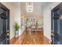 Stunning foyer with hardwood floors that transitions to a living room with a fireplace and many windows at 2525 Bent Tree Ln, Mount Pleasant, SC 29464