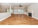 Spacious living room with a fireplace, built-in shelving, and plenty of natural light at 287 Commonwealth Rd, Mount Pleasant, SC 29466