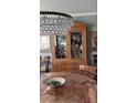 Elegant dining room featuring a crystal chandelier and built-in hutch at 330 Concord St # Th17, Charleston, SC 29401