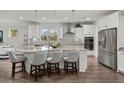 Gourmet kitchen featuring a large island with seating, stainless steel appliances, and ample cabinet space at 403 Hidden Meadow Ln, Summerville, SC 29486