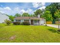 Traditional home with gray siding, manicured lawn, trimmed shrubs, and inviting front porch at 505 Laurel Ridge Rd, North Charleston, SC 29418