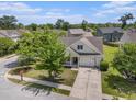 Aerial view of the home showing its location on a tree-lined street in a quiet residential neighborhood at 5400 Turning Tide, North Charleston, SC 29420