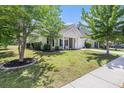 This charming home has manicured landscaping and a welcoming front porch, all enhancing its curb appeal at 5400 Turning Tide, North Charleston, SC 29420