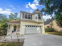 Beautiful home featuring manicured landscaping, a 2-car garage, inviting front porch, and situated in a serene neighborhood at 675 Fair Spring Dr, Charleston, SC 29414