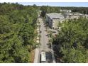 Aerial view of the neighborhood showcasing the condo buildings surrounded by lush greenery and streets at 7101 Bowen Corner Ave, Hanahan, SC 29410
