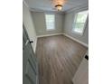 Bright bedroom with wood look floors, and fresh neutral paint at 78 Hannibal Trl, Ridgeville, SC 29472