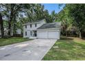 Charming two-story home with white painted brick and an attached two-car garage at 7993 Malden Ave, North Charleston, SC 29420
