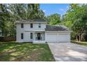 Charming two-story home with gray painted brick and an attached two-car garage at 7993 Malden Ave, North Charleston, SC 29420