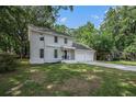Charming two-story home with white painted brick and an attached two-car garage at 7993 Malden Ave, North Charleston, SC 29420