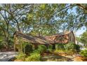 Lovely home featuring mature trees, lush greenery, and a well-maintained exterior at 810 Creekside Dr, Mount Pleasant, SC 29464