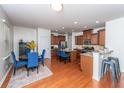 Open kitchen with stainless steel appliances, granite countertops, a central island, and a breakfast nook at 9767 Black Willow Ln, Ladson, SC 29456