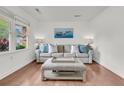 Inviting living room showcasing hardwood floors, natural light, and comfortable seating arrangement at 108 Williamsburg Ct, Goose Creek, SC 29445