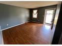 Cozy living room with laminate floors and a window with neutral drapes at 1110 Pickett St, Moncks Corner, SC 29461
