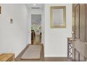Home entryway featuring hardwood floors, a mirror and view into the living room at 113 Alpine Rd, Summerville, SC 29485
