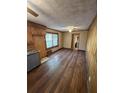 Dining area with wood paneling and wood-look flooring at 1138 Landsdowne Dr, Charleston, SC 29412