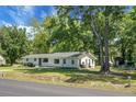 Well-kept single-story home with a classic design and mature trees in a quiet setting at 1192 Church Of God Rd, Bonneau, SC 29431