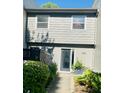 Charming two-story townhome with gray siding, a walkway, and neat landscaping at 1202 Ventura Pl, Mount Pleasant, SC 29464