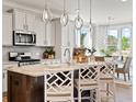 Modern kitchen featuring a large island, pendant lighting, stainless steel appliances and an eat-in dining area at 1206 Homecoming Blvd, Ravenel, SC 29470