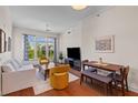 Bright living room with a ceiling fan, hardwood floors and natural light filling the space at 125 Pier View St # 405, Daniel Island, SC 29492