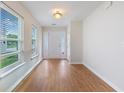 Bright foyer featuring wood floors, a white front door, and plentiful natural light at 151 Tyger St, Summerville, SC 29485