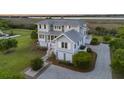 Gorgeous waterfront home with meticulous landscaping, spacious lot, and a private driveway at 1518 Bower Ln, Johns Island, SC 29455