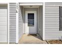 Close up of front door shows a secure entrance and well-maintained siding at 157 Tyger St, Summerville, SC 29485