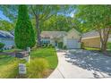 A well maintained home with a lush lawn and tree shaded front yard at 2418 Tuscany Dr, North Charleston, SC 29406