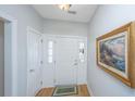 Bright foyer with hardwood floors, white trim, and decorative artwork at 2418 Tuscany Dr, North Charleston, SC 29406