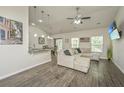 Cozy living room with comfortable seating, a ceiling fan, and great natural lighting at 409 Carousel Ct, Summerville, SC 29483